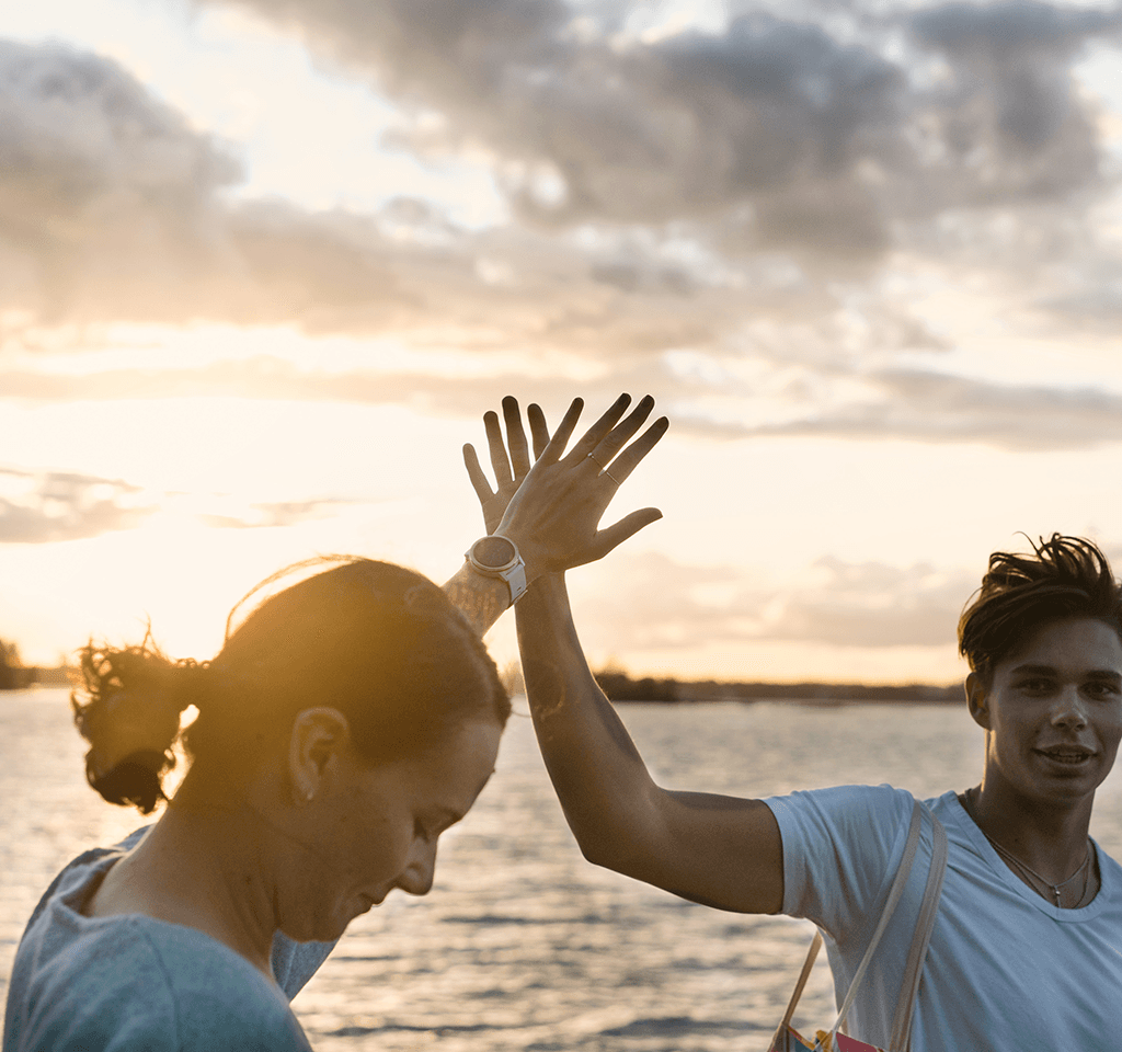 Two people giving high five.